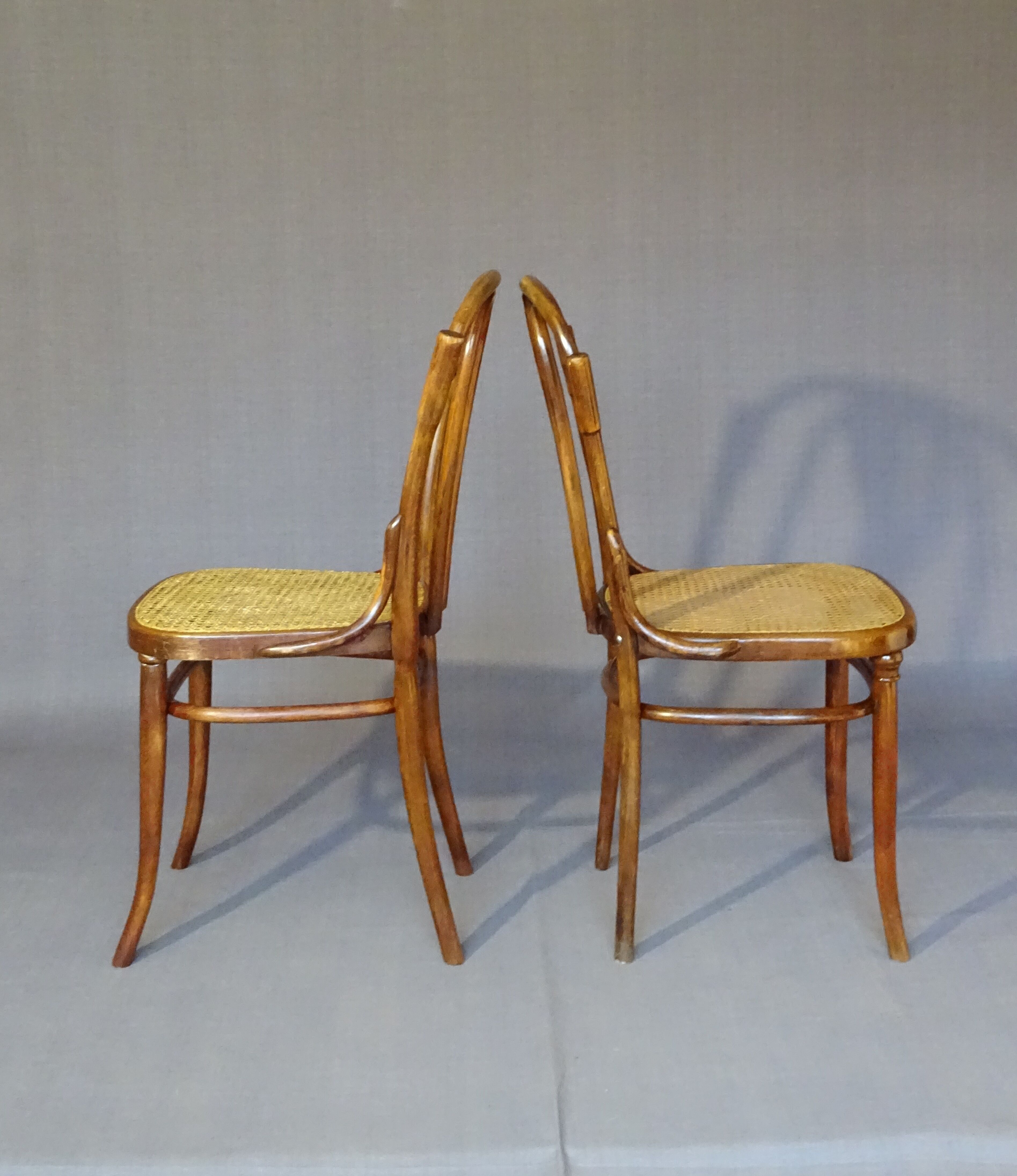 Fake pair of Kohn and Turpe tanned bistro chairs, circa 1900,