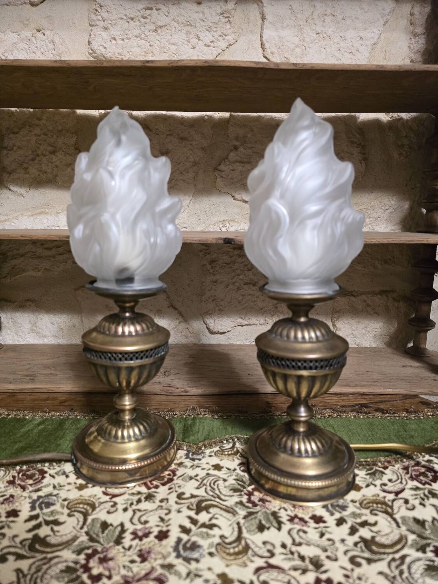 Small globe lamp with flame and brass base for oil.
