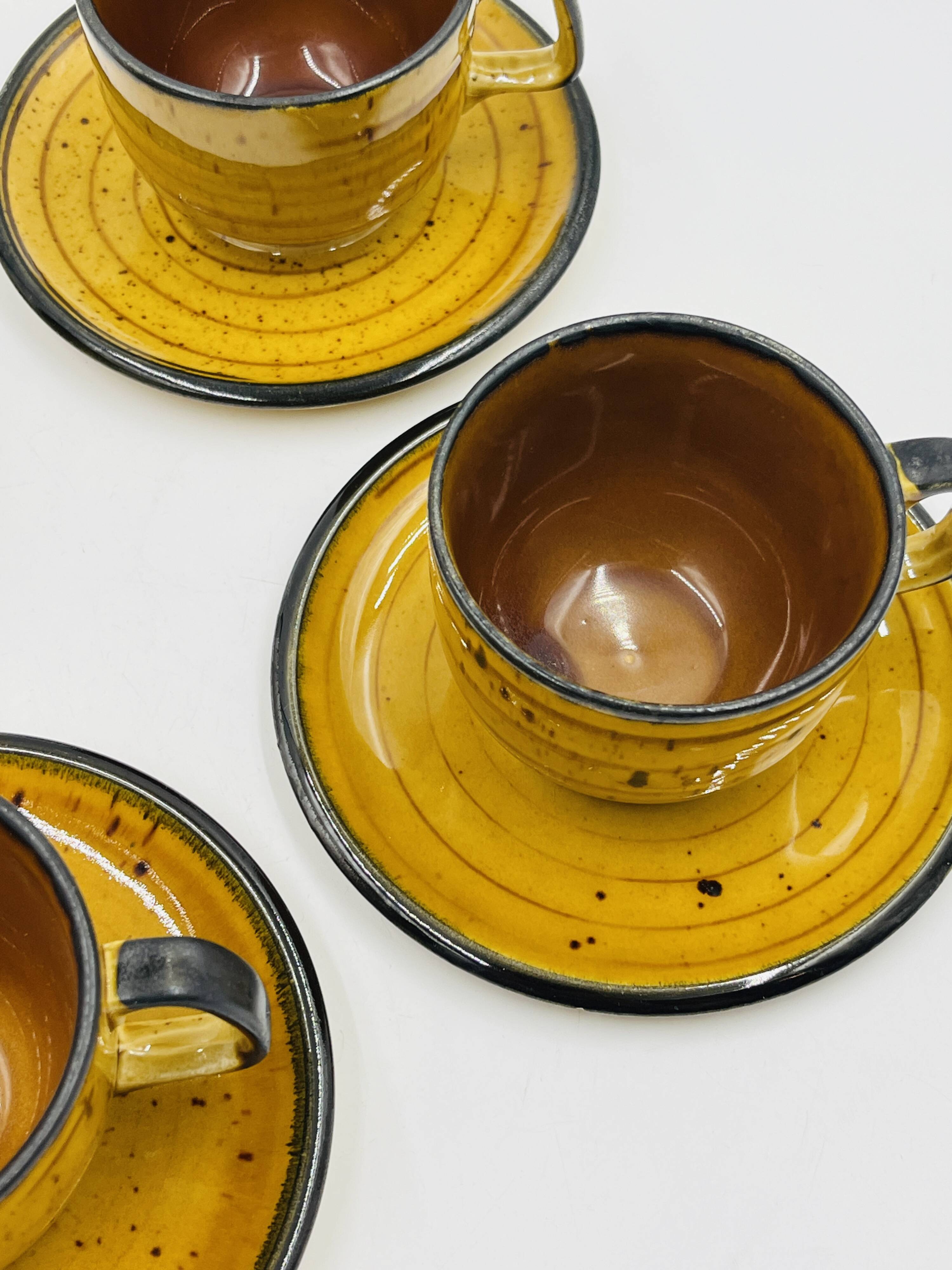 Set of four vintage Boch Palma cups and saucers.