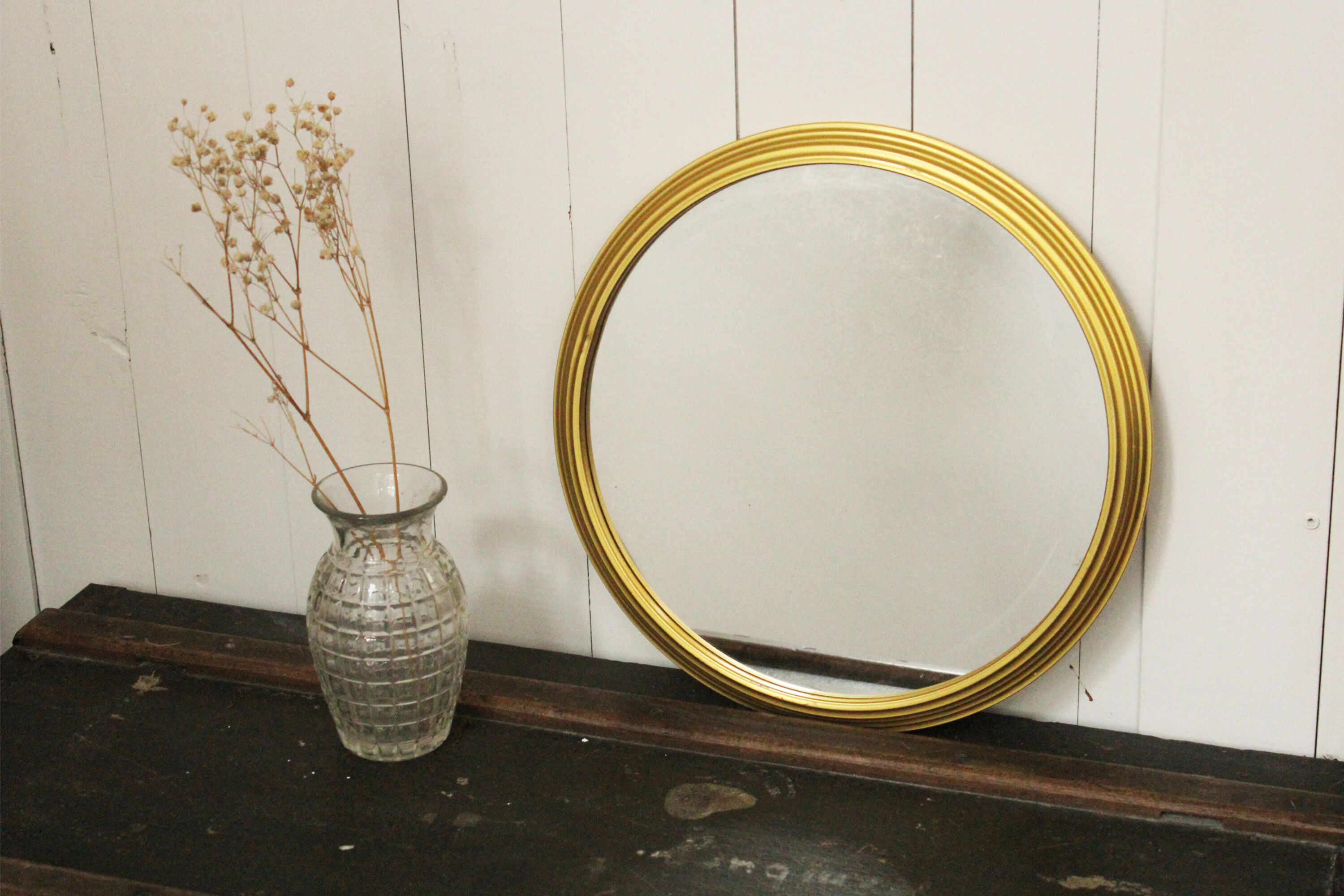 Miroir vintage rond  bordure acier doré
