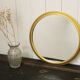 Miroir vintage rond  bordure acier doré