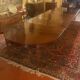 Extensible dining table from the Louis XVI period in mahogany with a banded top.