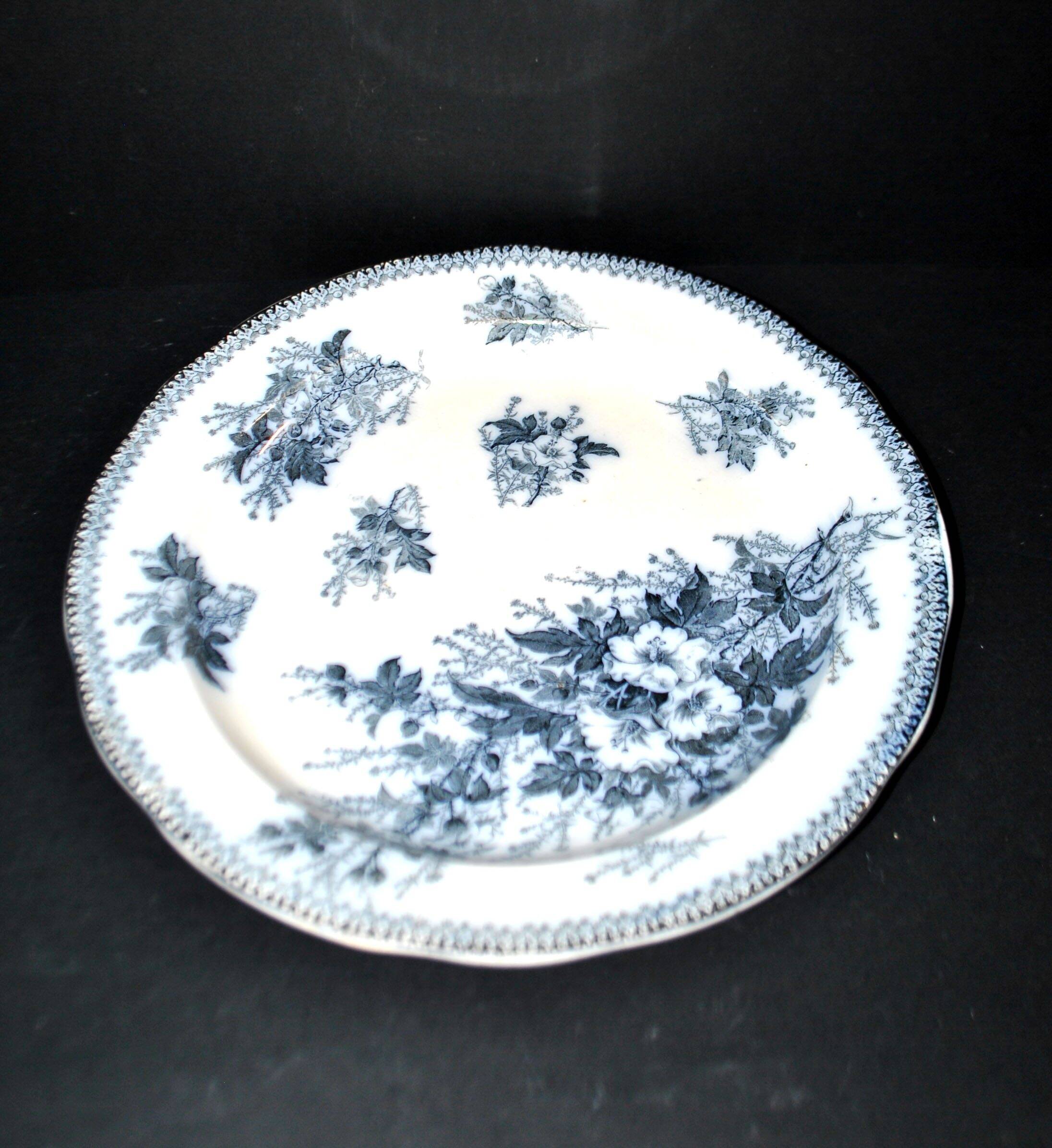 Large round antique plate with monochrome blue and black floral decoration, circa 1850.