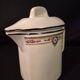 Old covered jug, vintage, geometric frieze with flowers and black trim.