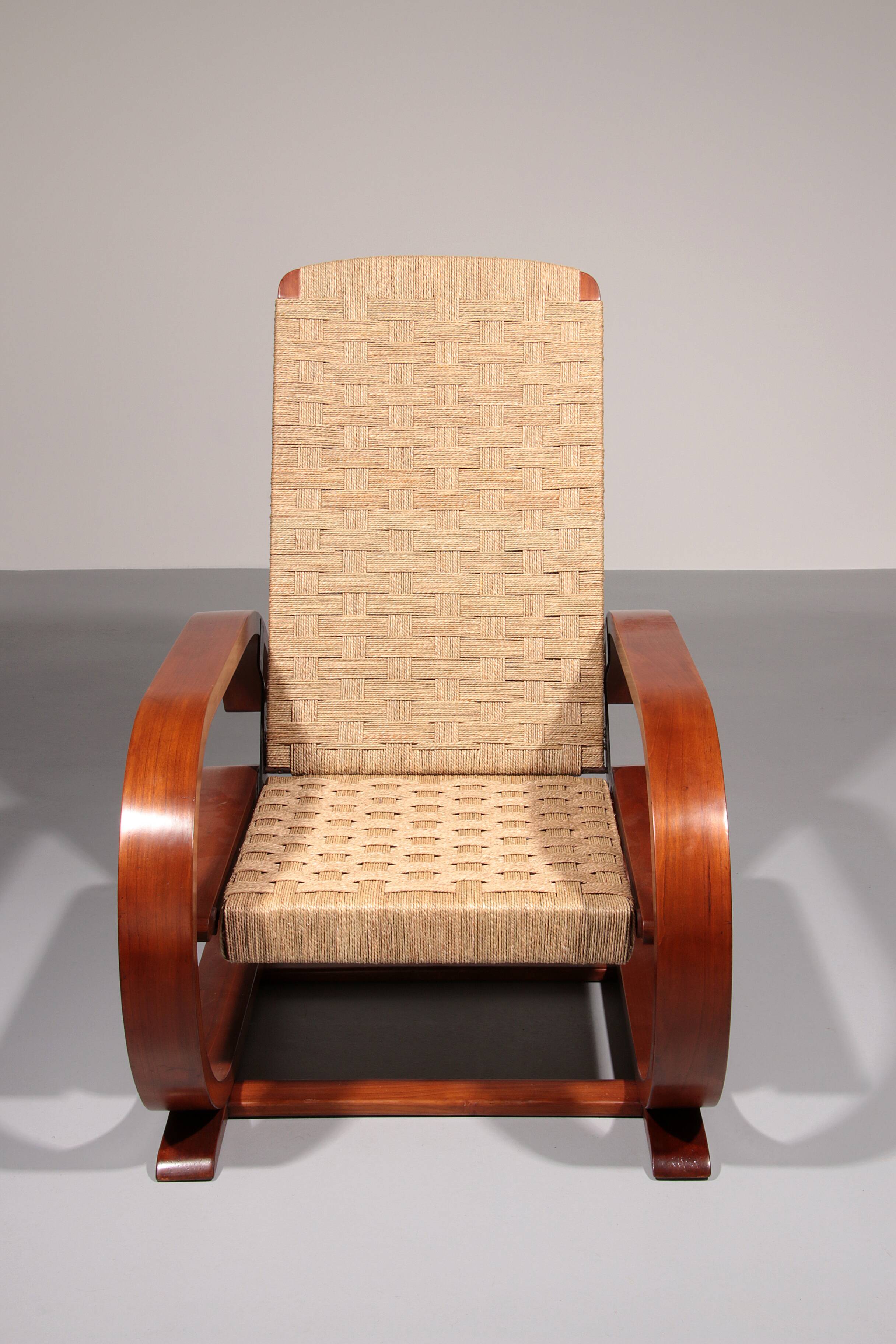 An exceptionally rare mahogany recliner crafted in Italy during the 1950s"