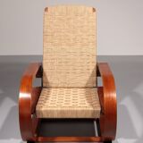 An exceptionally rare mahogany recliner crafted in Italy during the 1950s"