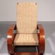 An exceptionally rare mahogany recliner crafted in Italy during the 1950s"