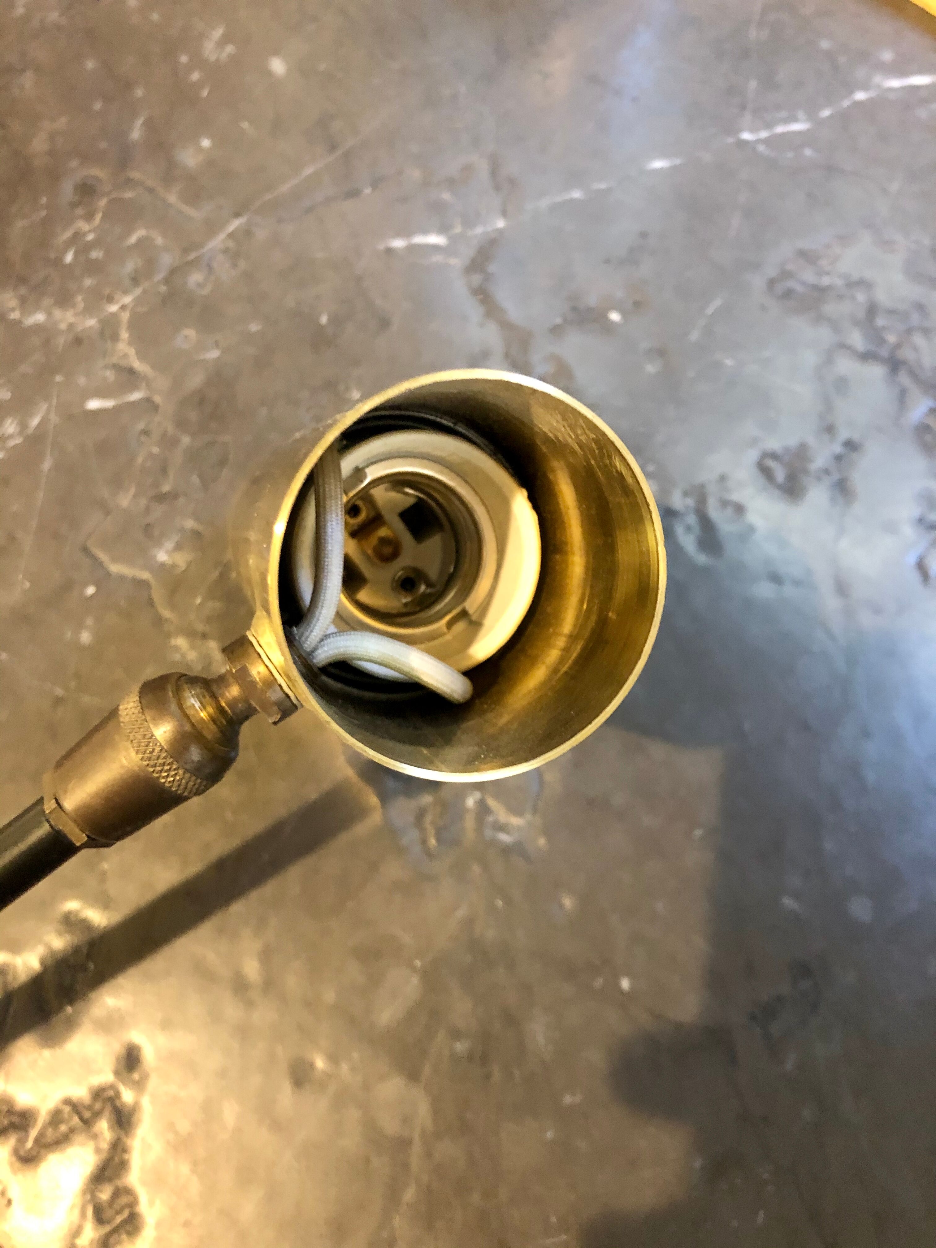 Sconce in gold brass and black metal