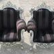A pair of vintage armchairs, 1980s, lacquered wood and fabric