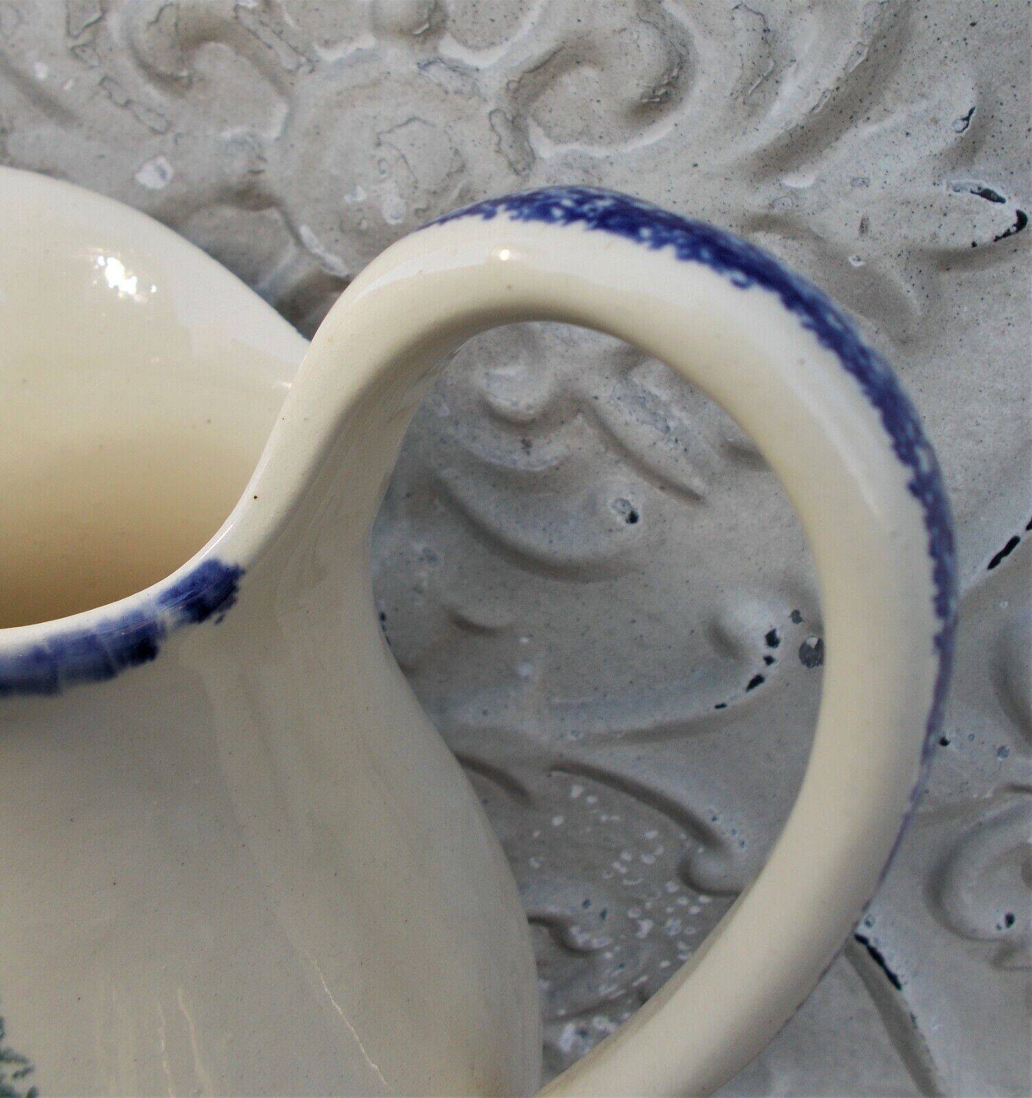 1 St Clément earthenware pouring jug decorated with characters