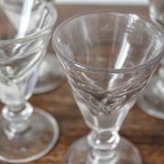 4 antique stemmed wine glasses with flat sides, made of blown glass from the 19th century