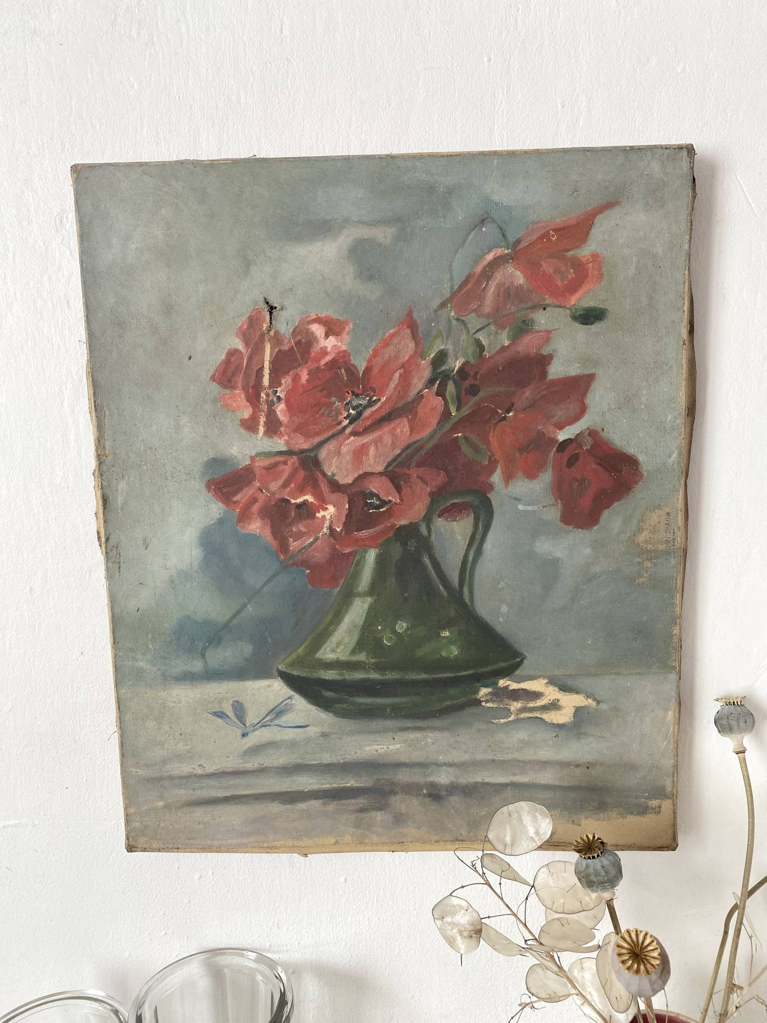Old painting of a bouquet of poppies, canvas on a flower frame