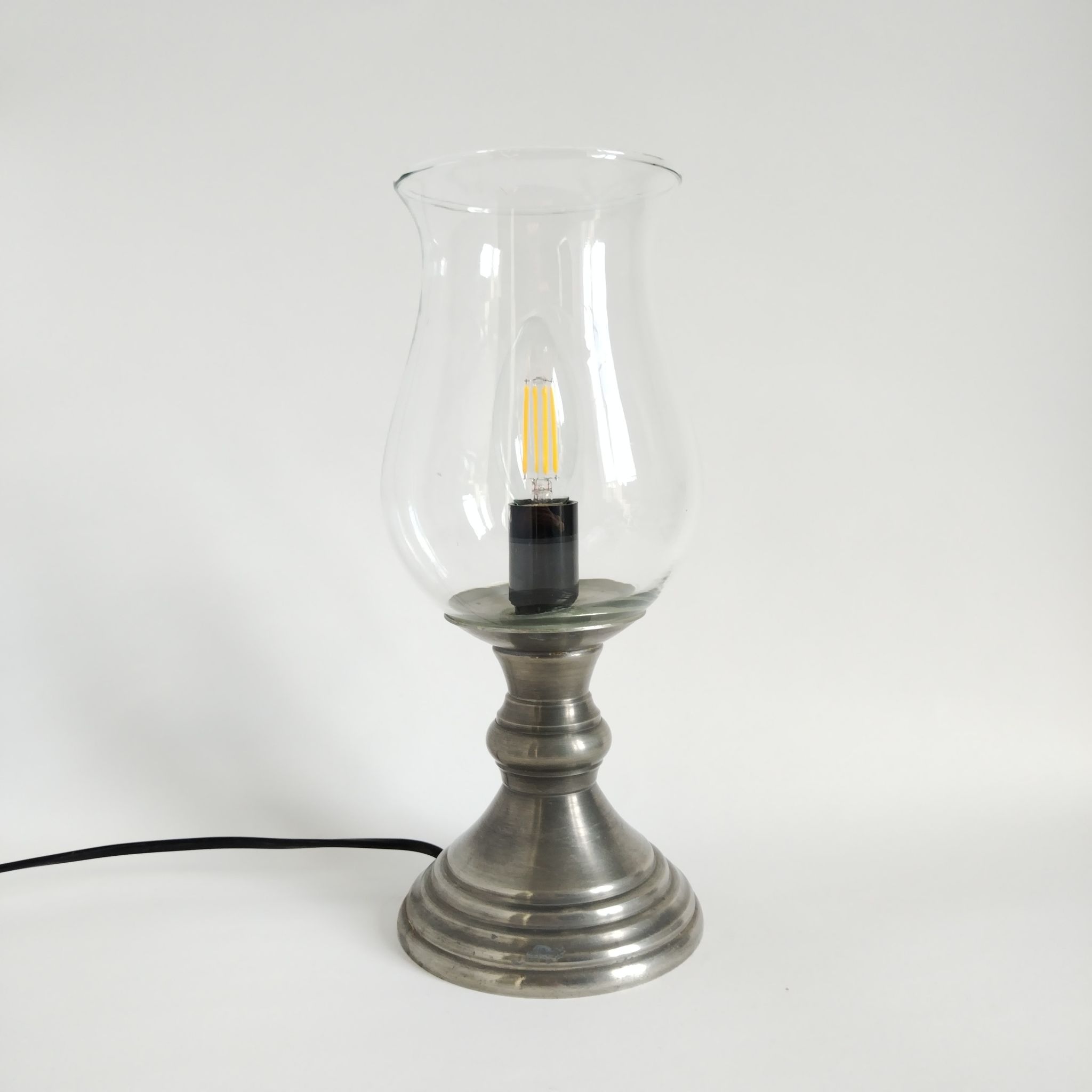 Vintage lamp consisting of a glass tulip-shaped fireplace and a pewter foot