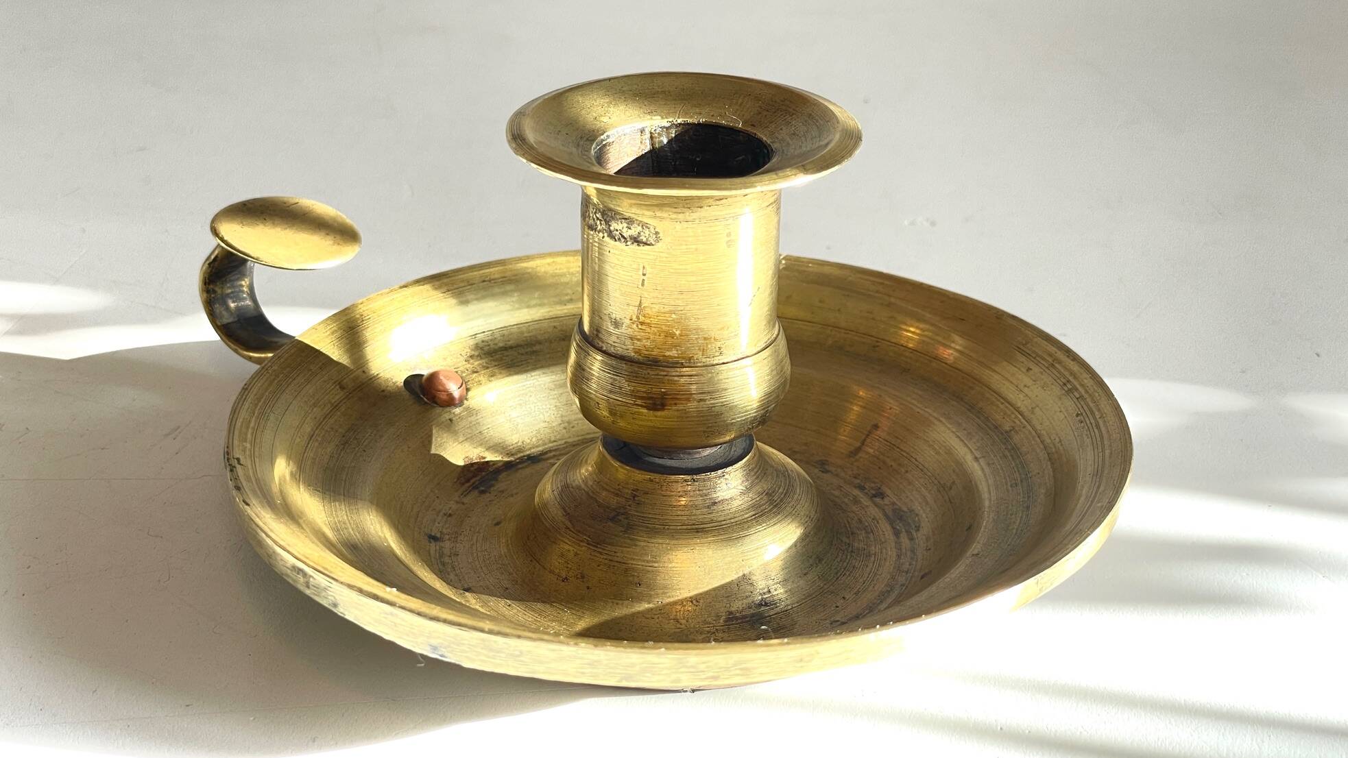 Antique solid bronze hand candlestick