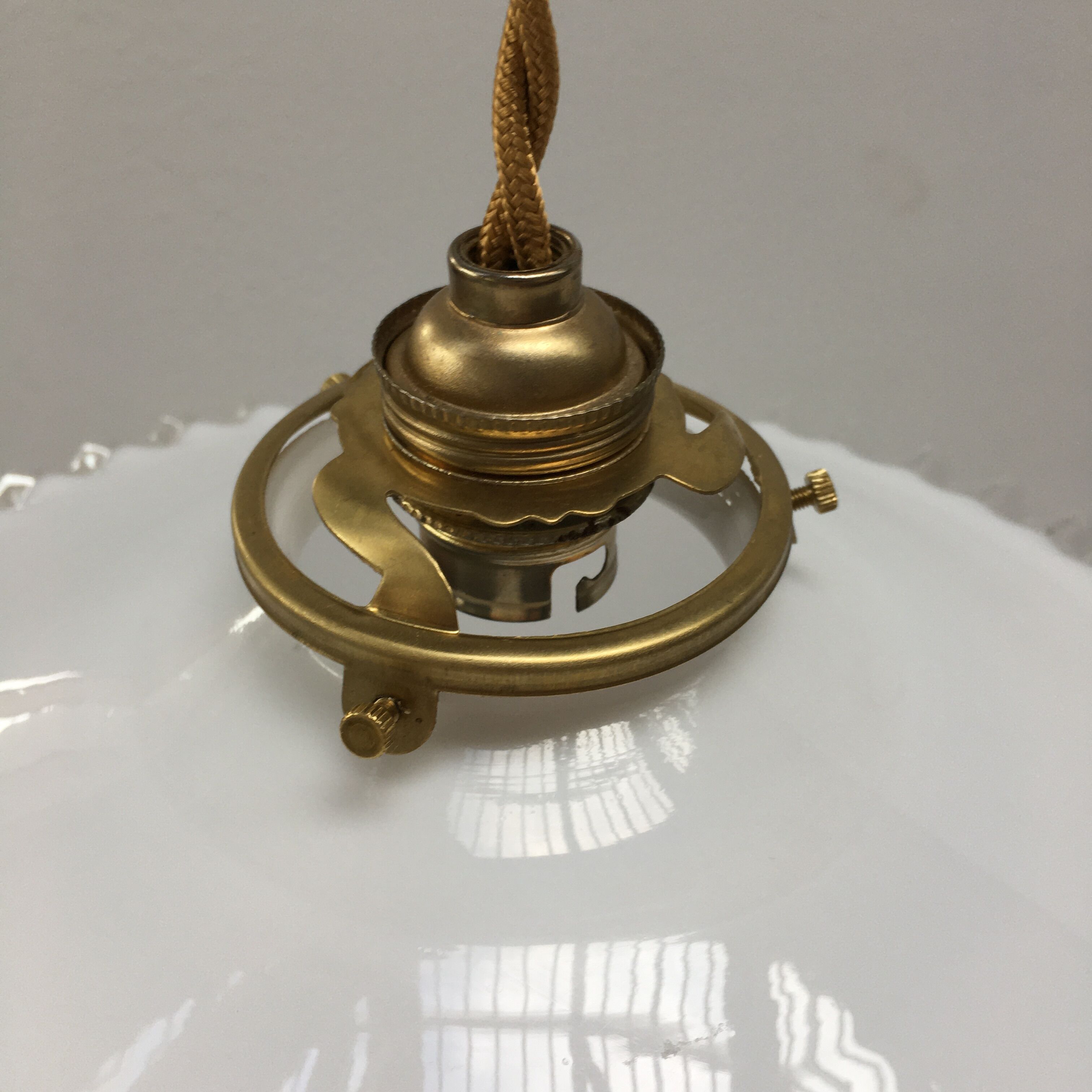 Pair of white opaline suspensions with serrated edges