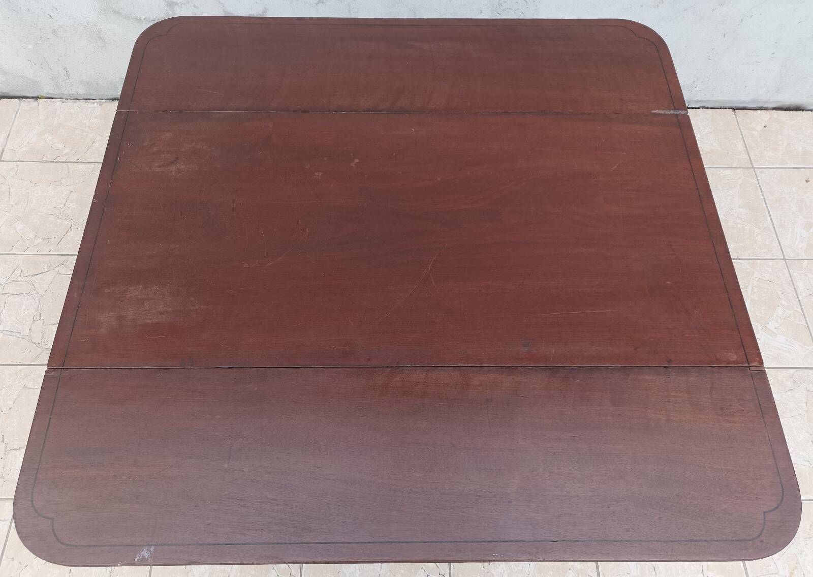 19th-century English style mahogany drop-leaf table.