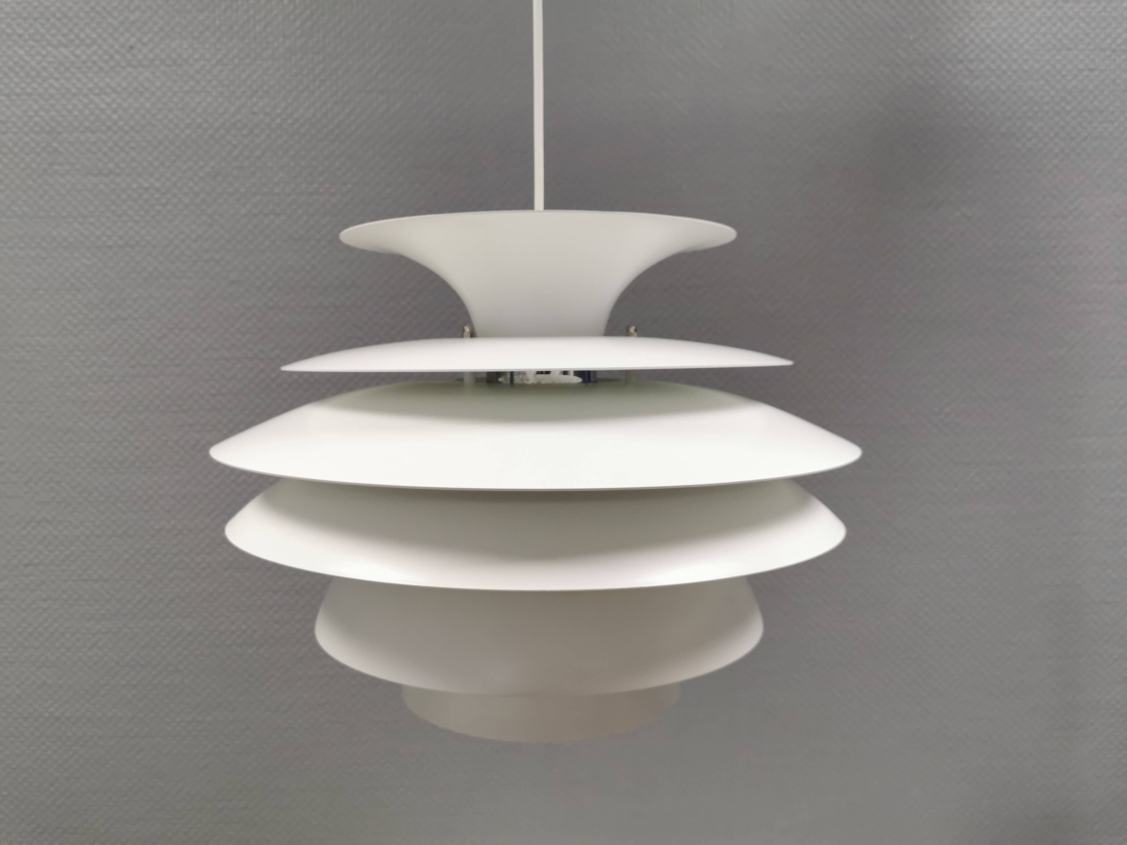 Hanging lamp with multiple layers of shades, by Junge/Vitrika