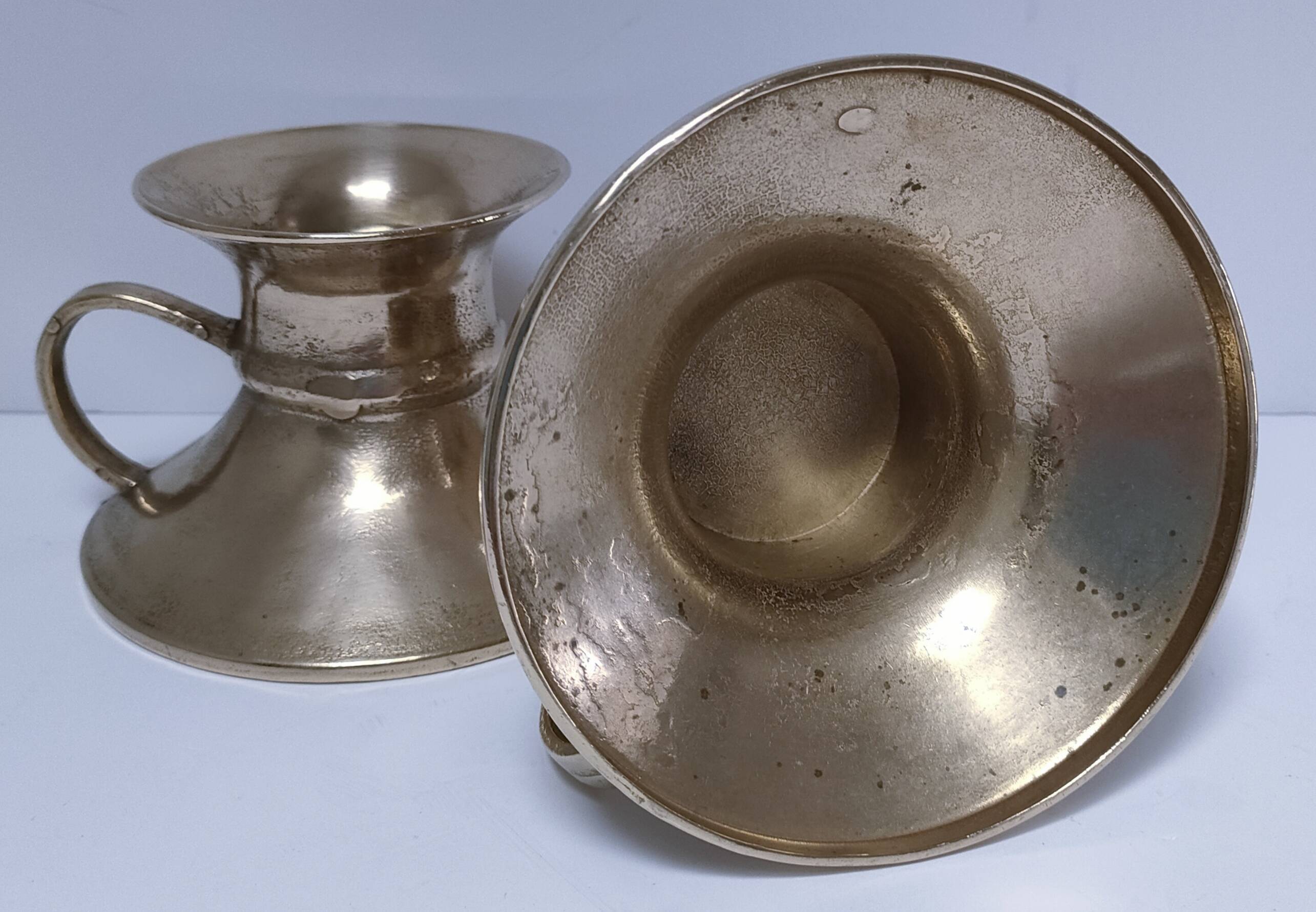 Pair of vintage solid brass hand candlesticks