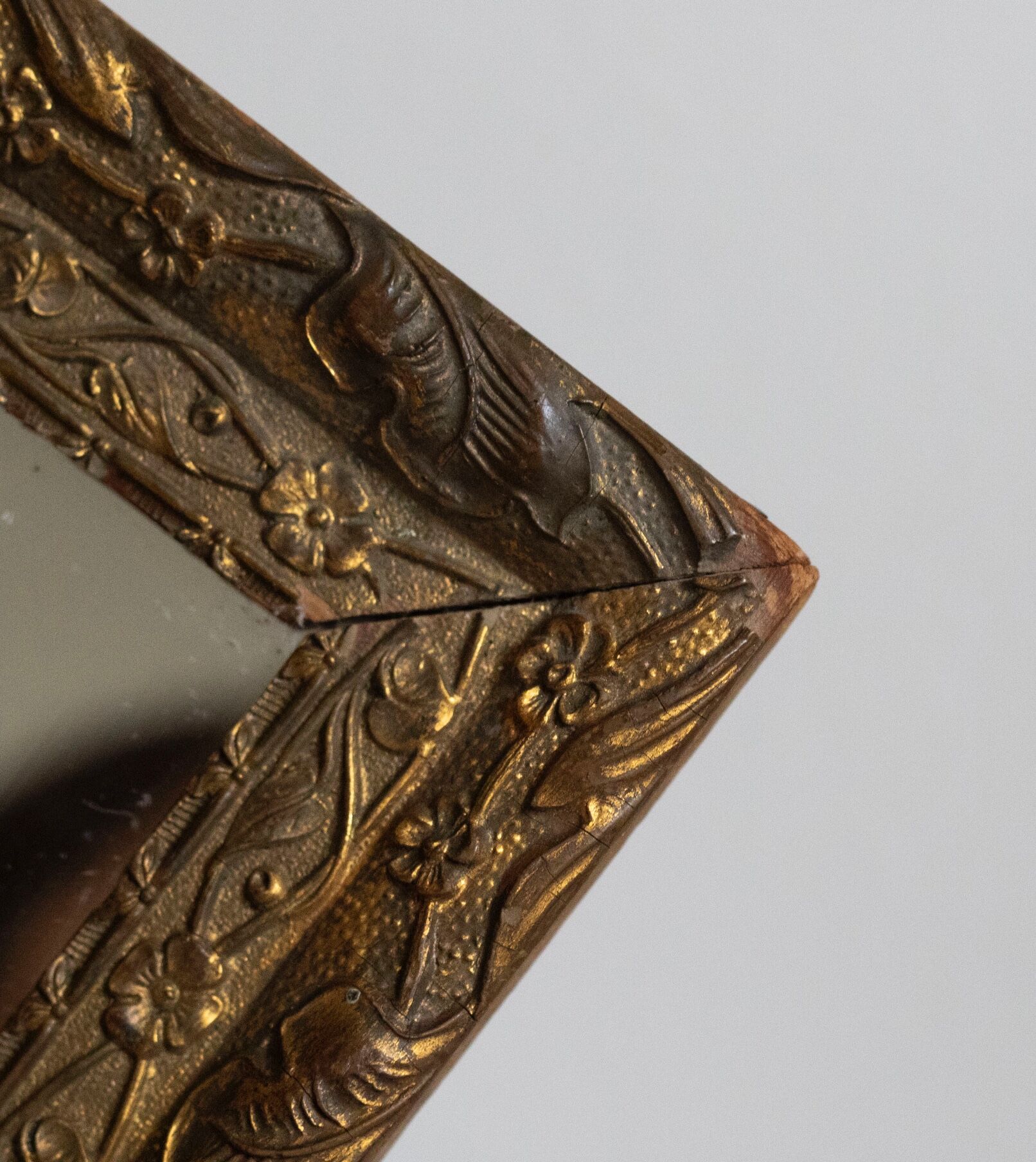Antique mirror in gilded wood