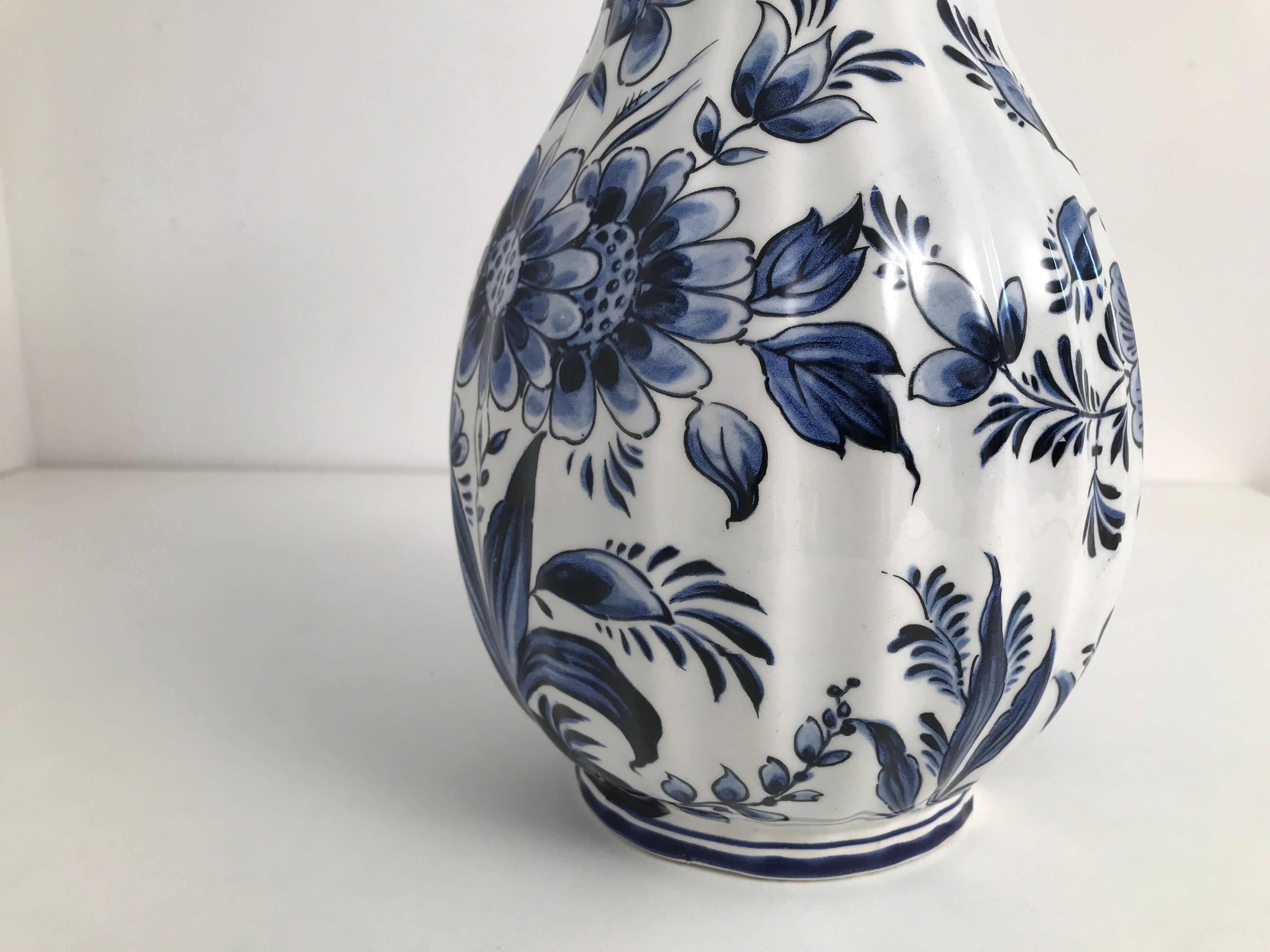 Vase with vintage blue and white flower pattern signed