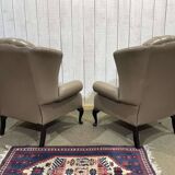 Pair of high-backed Chesterfield armchairs with 1 leather footrest