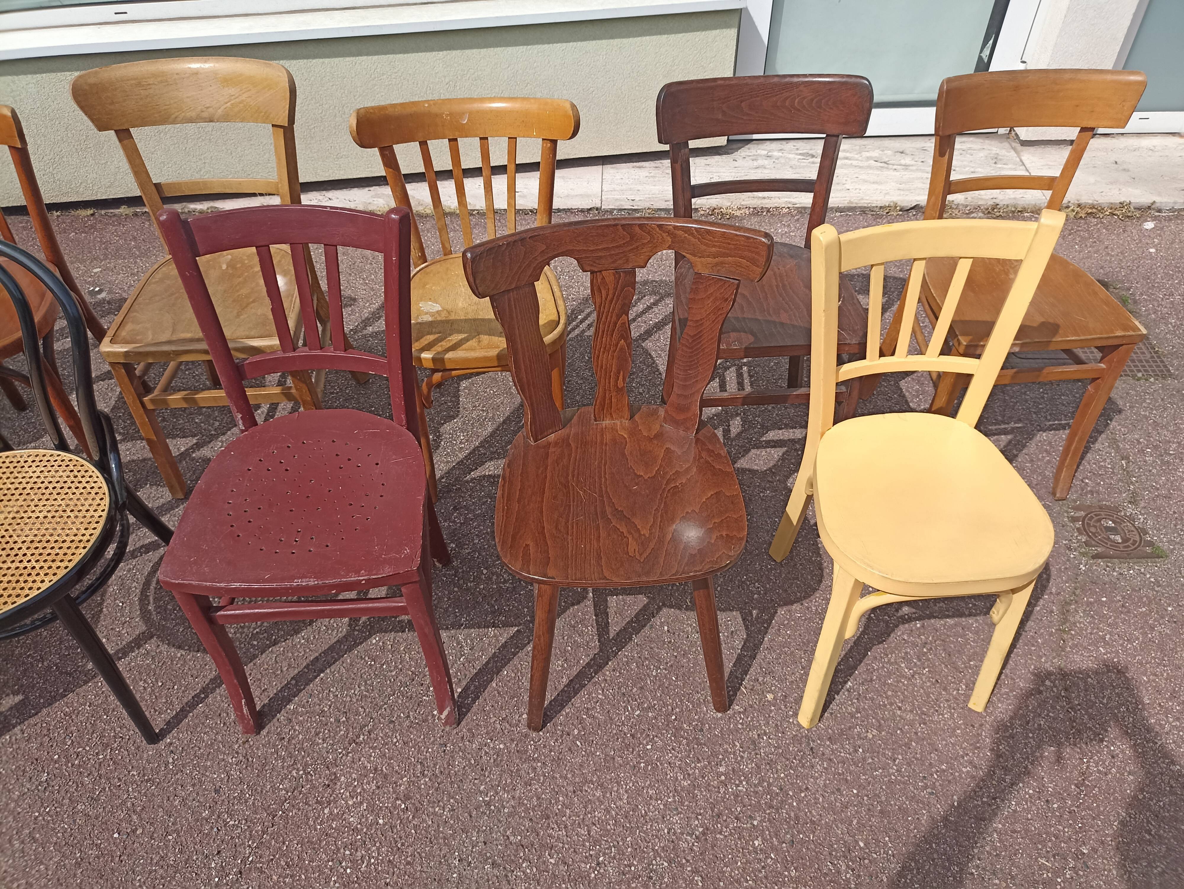 Set of 12 mismatched wooden bistro chairs