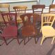 Set of 12 mismatched wooden bistro chairs