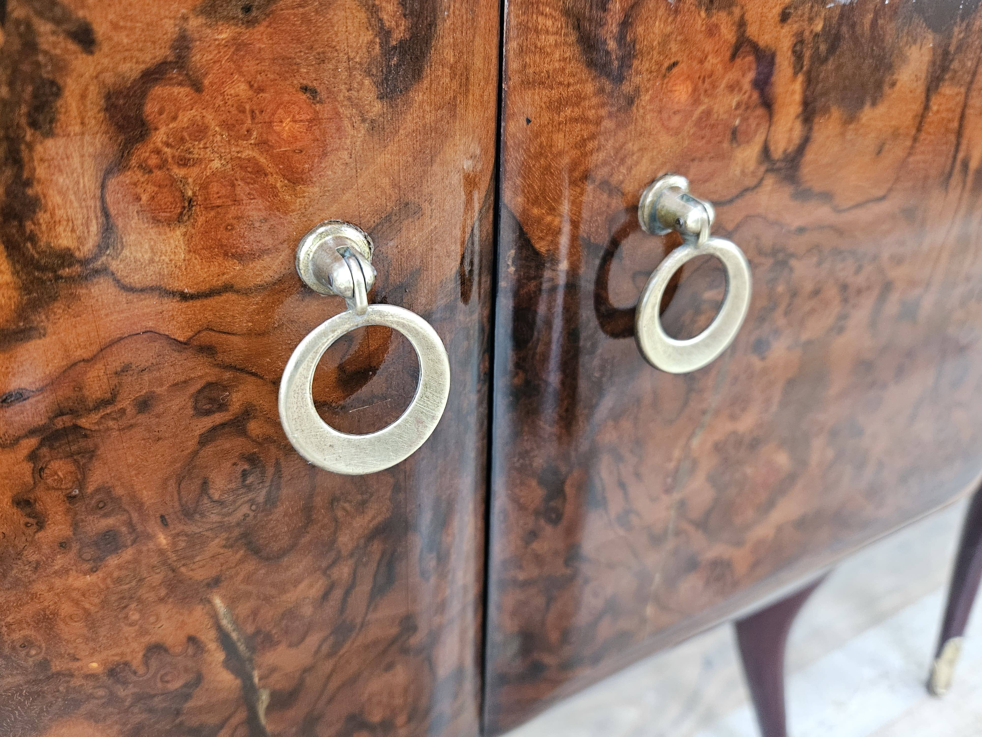 Mid-century mahogany bedside tables with mirrored tops.