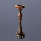 Old ashtray on carved wooden stand