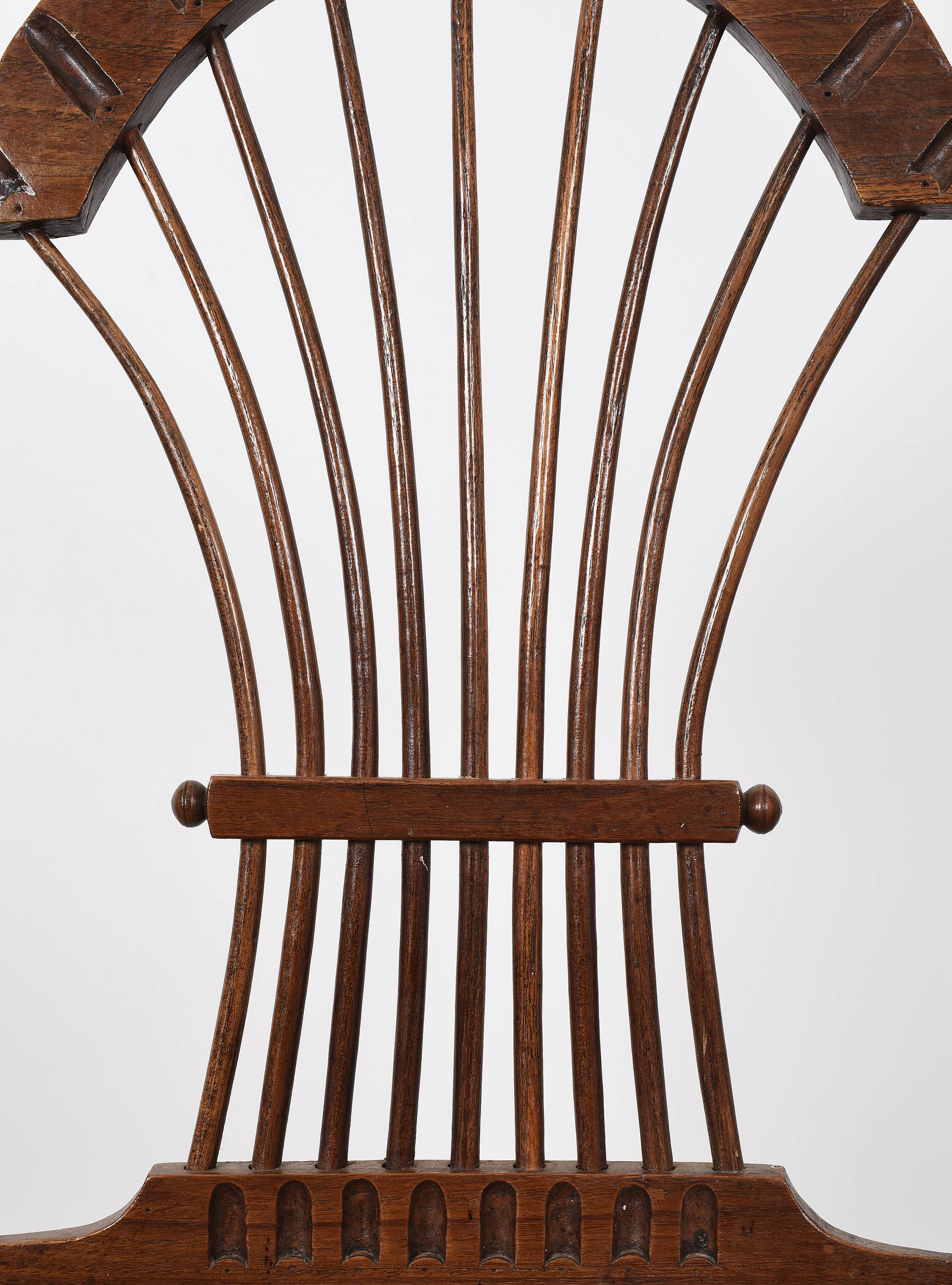 3 wooden and straw chairs, decorated with a sheaf of wheat.