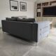 Three-seater grey mottled fabric sofa