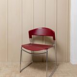 Red plastic-seat stacking chair with chrome frame by Paolo Favaretto for Assisa (Italy 1986) – vintage design