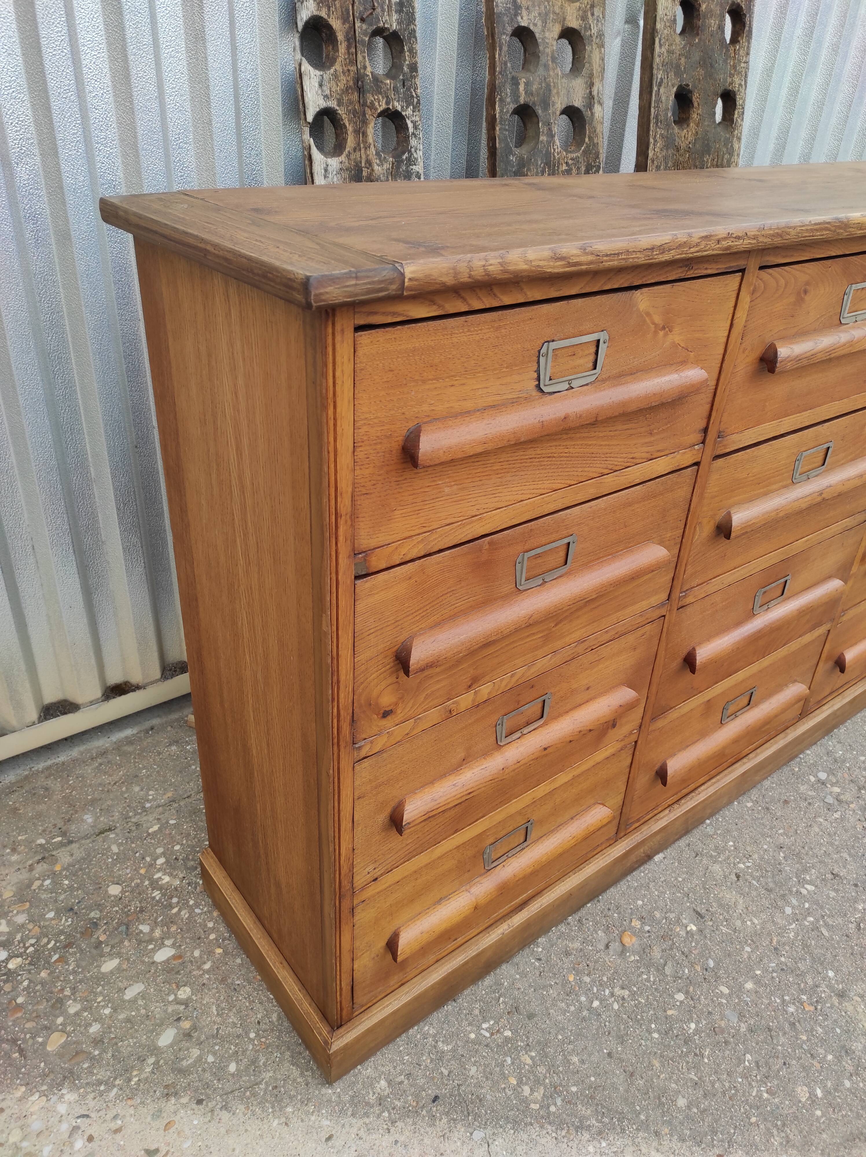 Trade furniture with 12 drawers in gilded oak