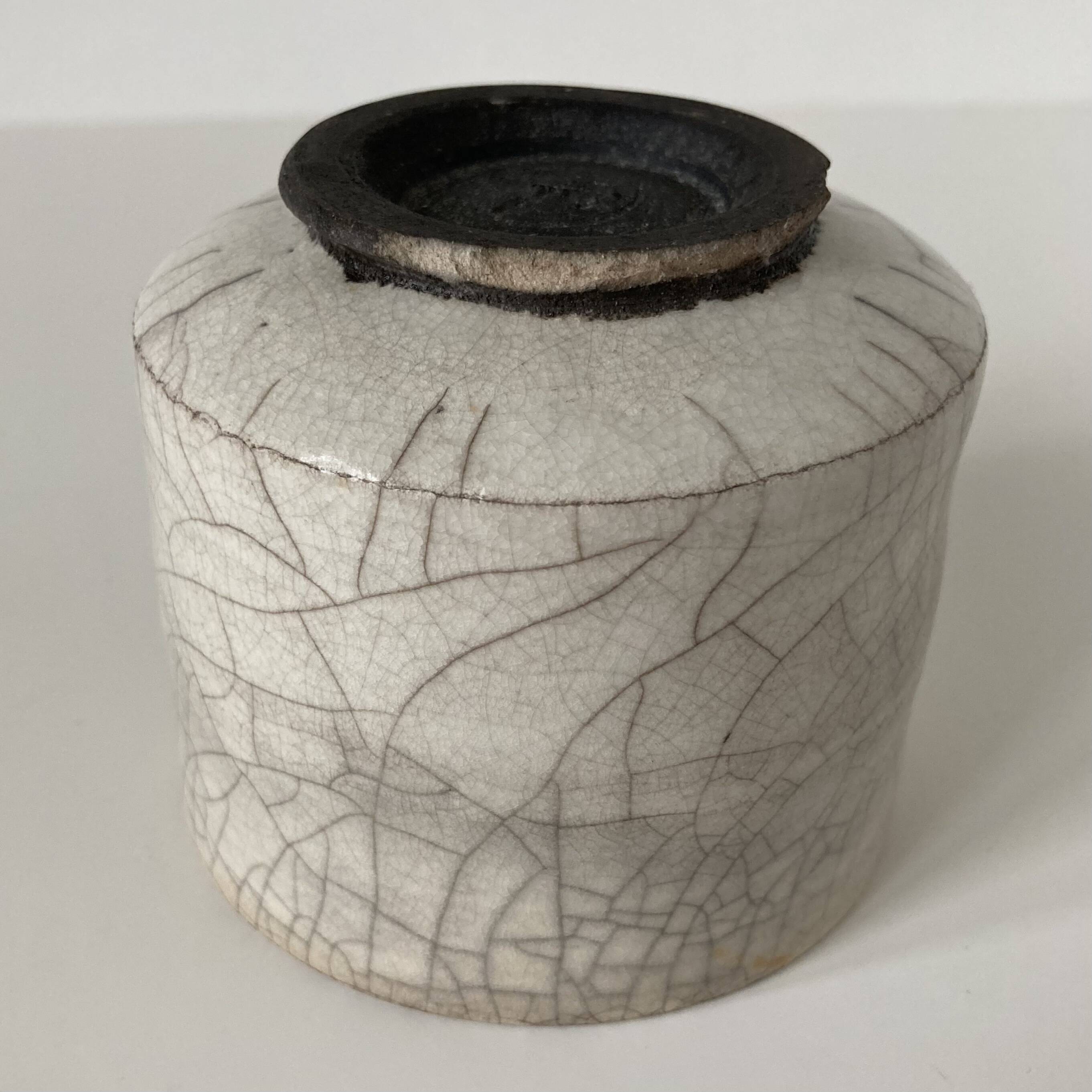Traditional raku ceramic tea or matcha bowl with mark on the base