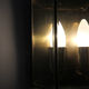 Wall sconce in brass and glass