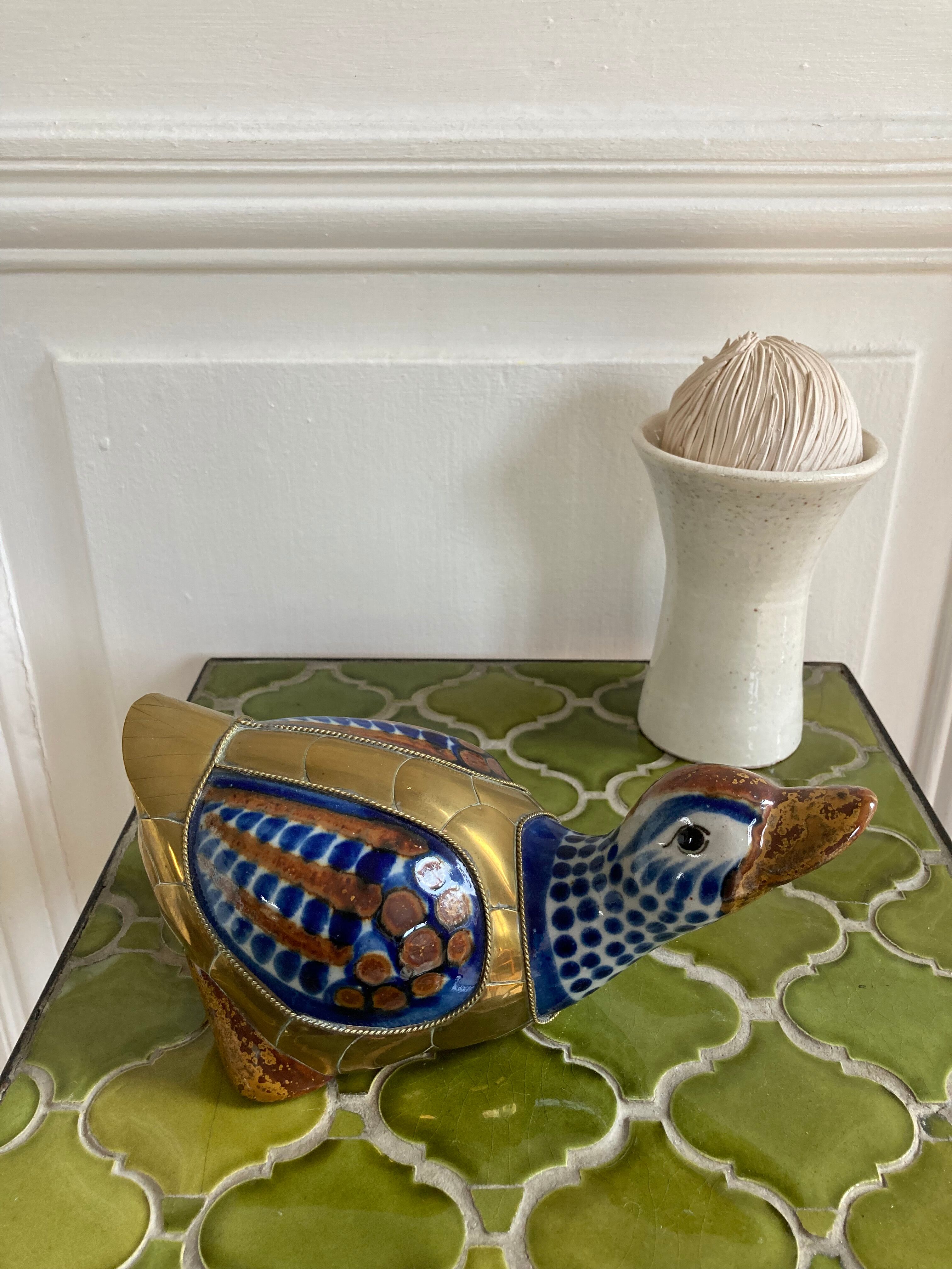 Brass duck and ceramic