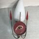 Golden metal wall sconce with red and white opaline reflectors