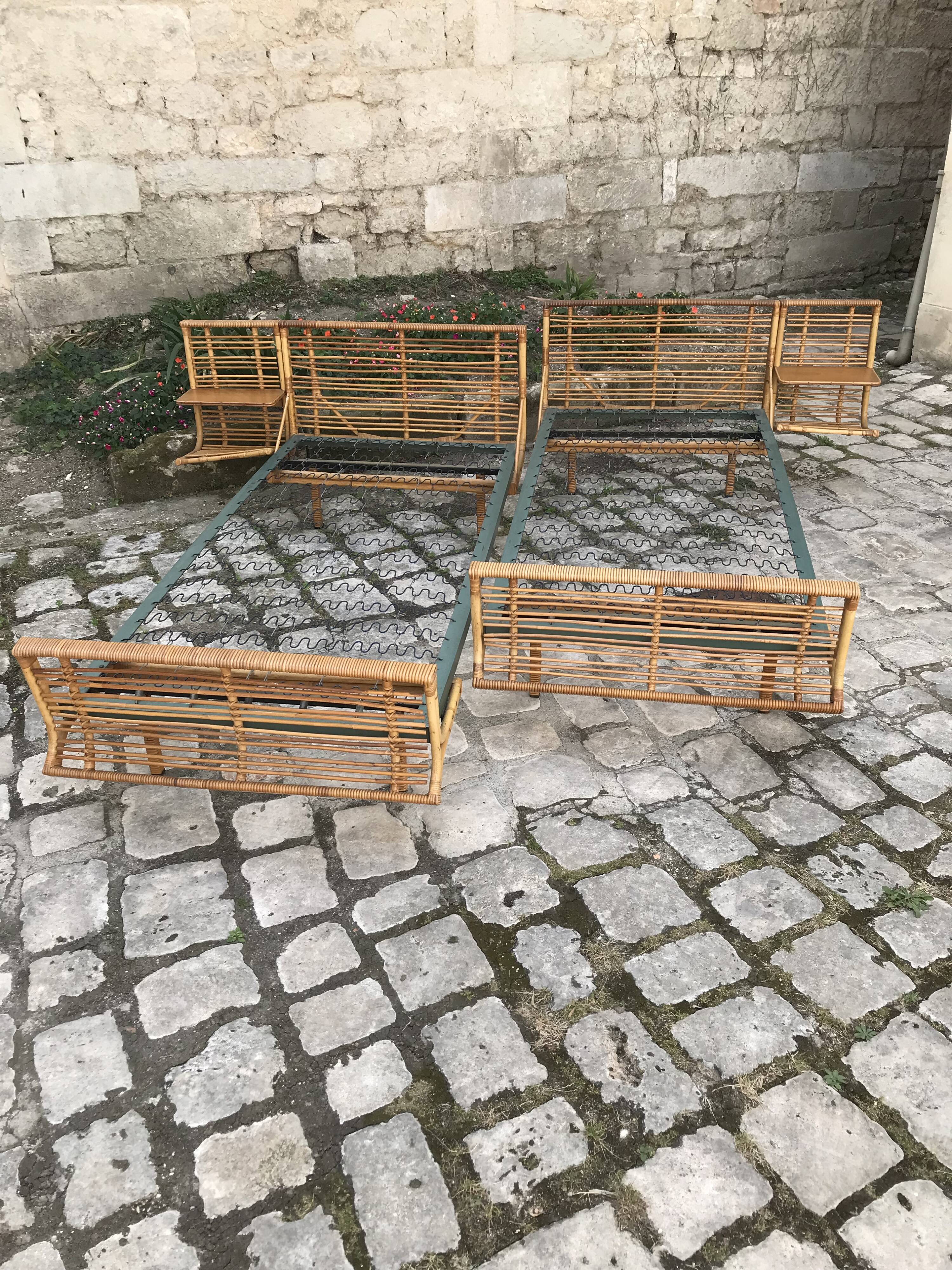 Twin rattan beds with built-in bedside tables
