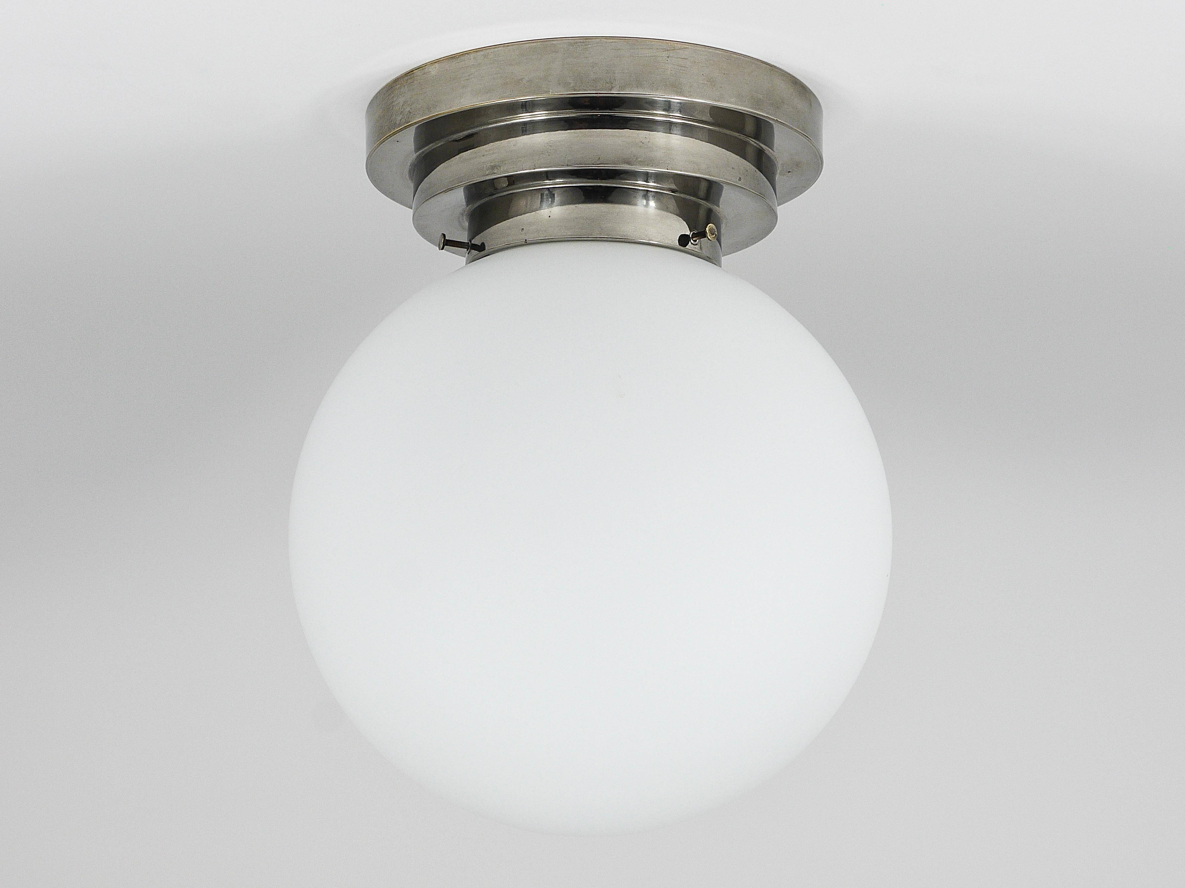 Large opaline glass globe ceiling lamp in Art Deco style.