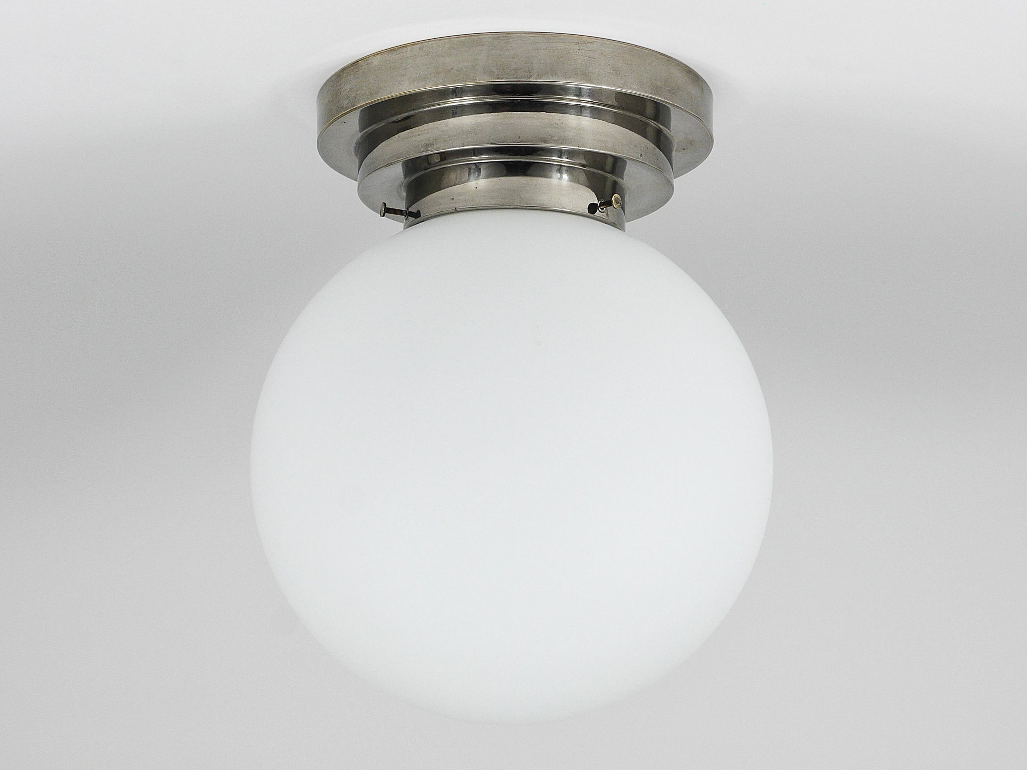 Large opaline glass globe ceiling lamp in Art Deco style.