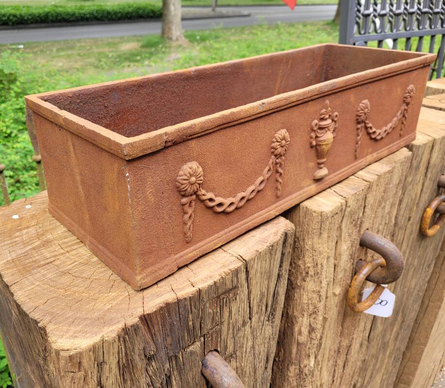 Rusty cast iron jardiniere planter
