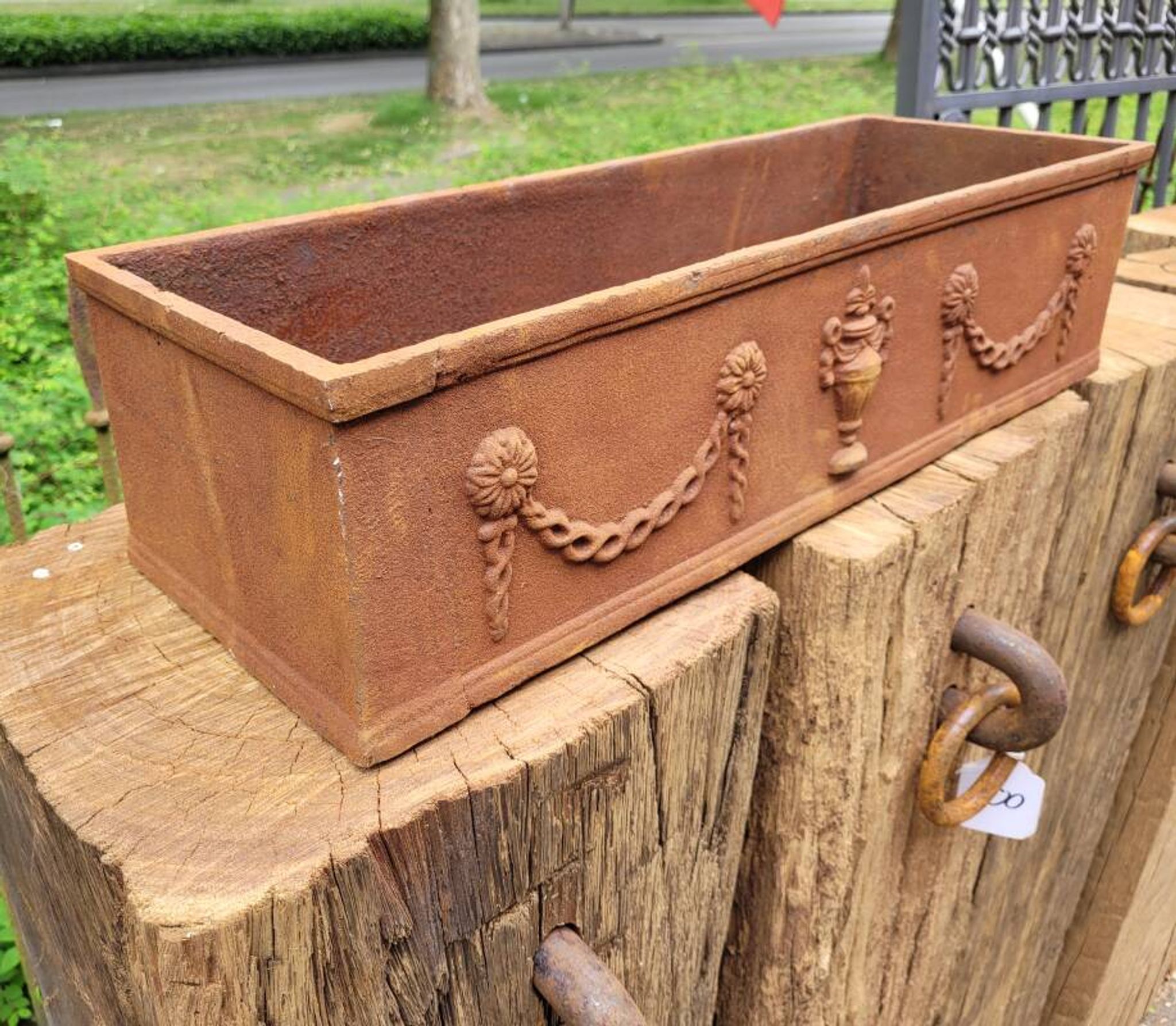 Rusty cast iron jardiniere planter