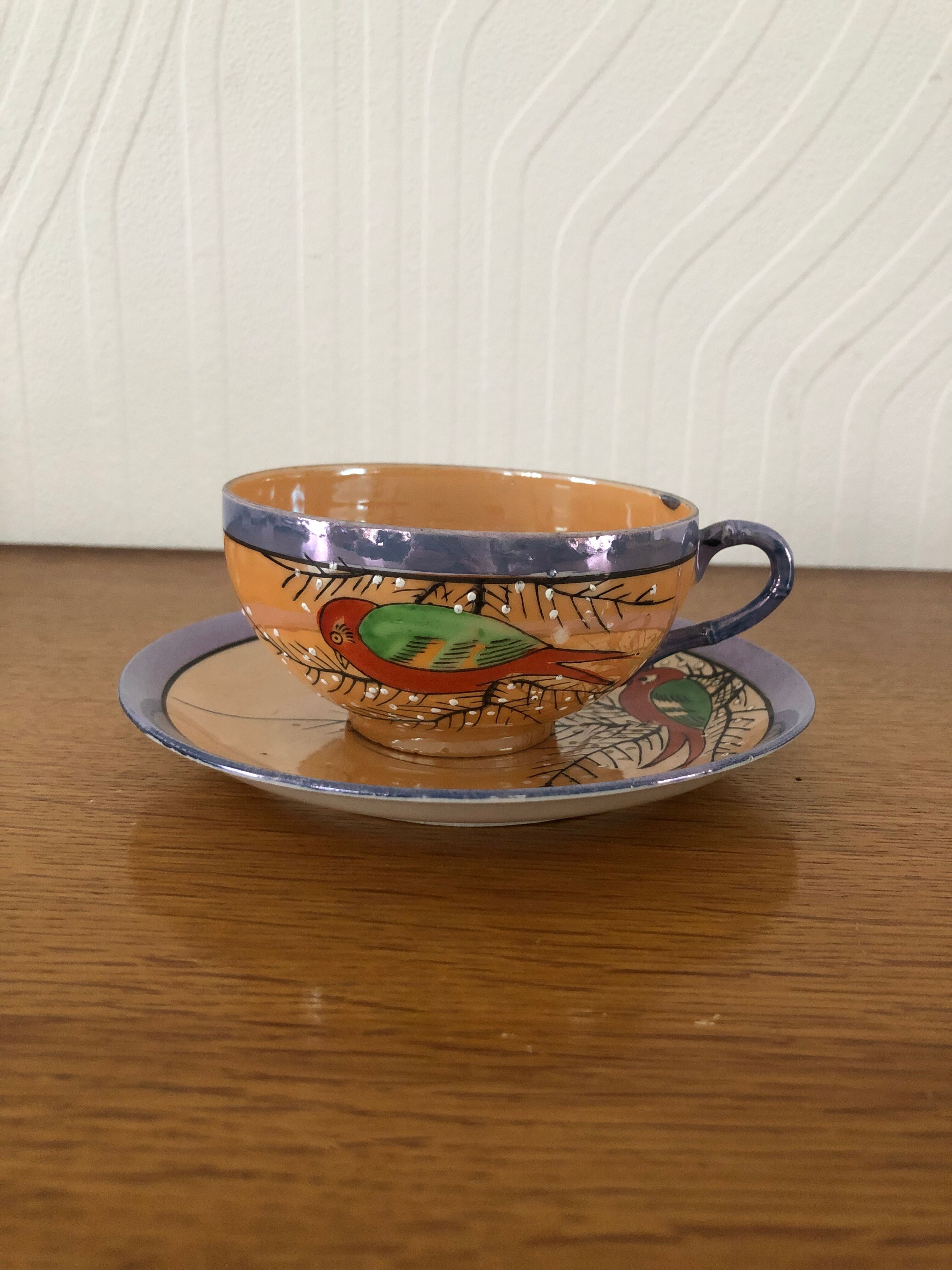 Coffee cup and under cup or tea made of iridescent Japanese porcelain