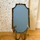 Miroir mural avec bougeoirs en métal doré et pampilles