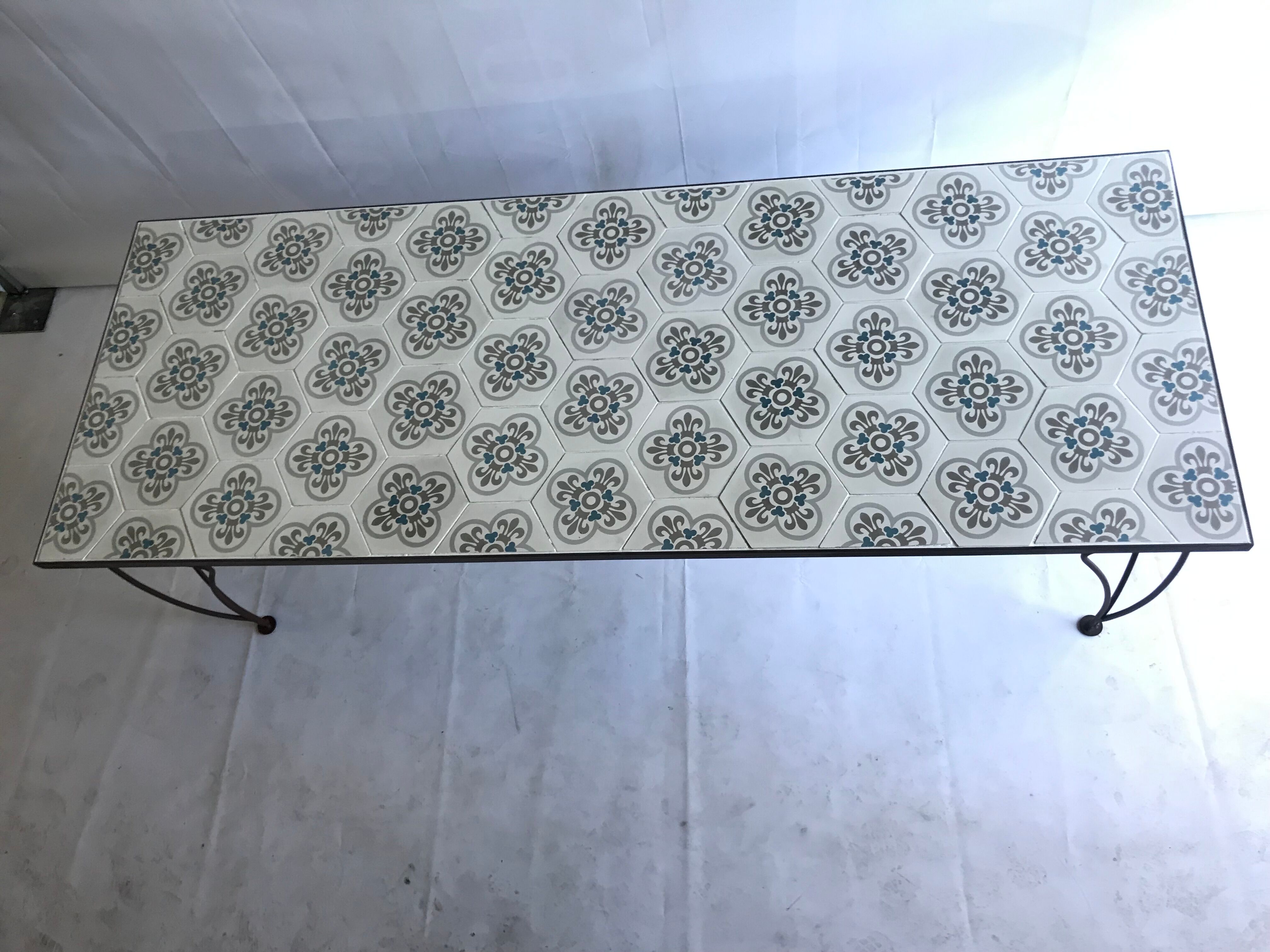 Wrought iron table and cement tile