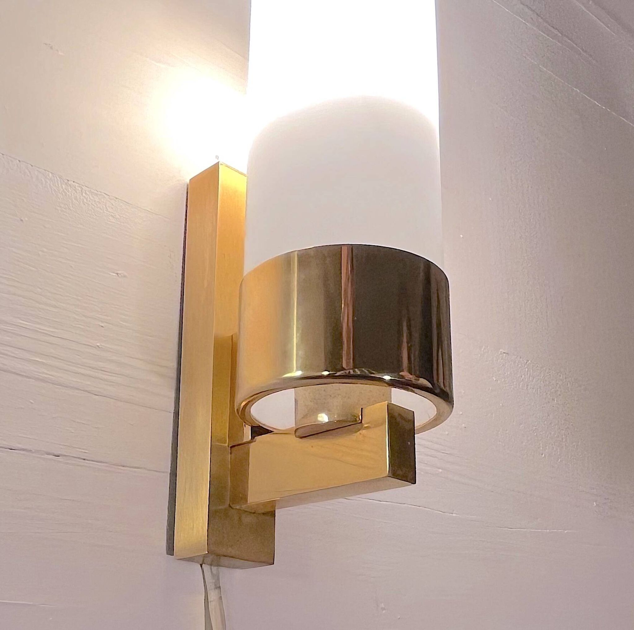 Set of three brass and opaline sconces, mid-century France