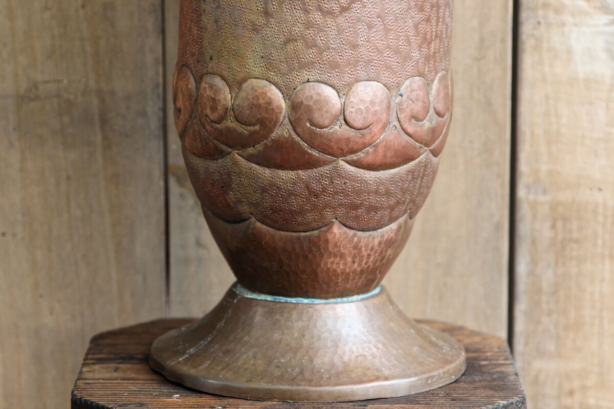 Copper vase hammered on pedestal