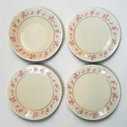4 flat plates in fine Limoges porcelain from the Raynaud house.