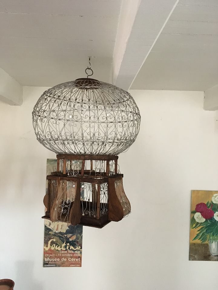 Decorative bird cage of iron and wood
