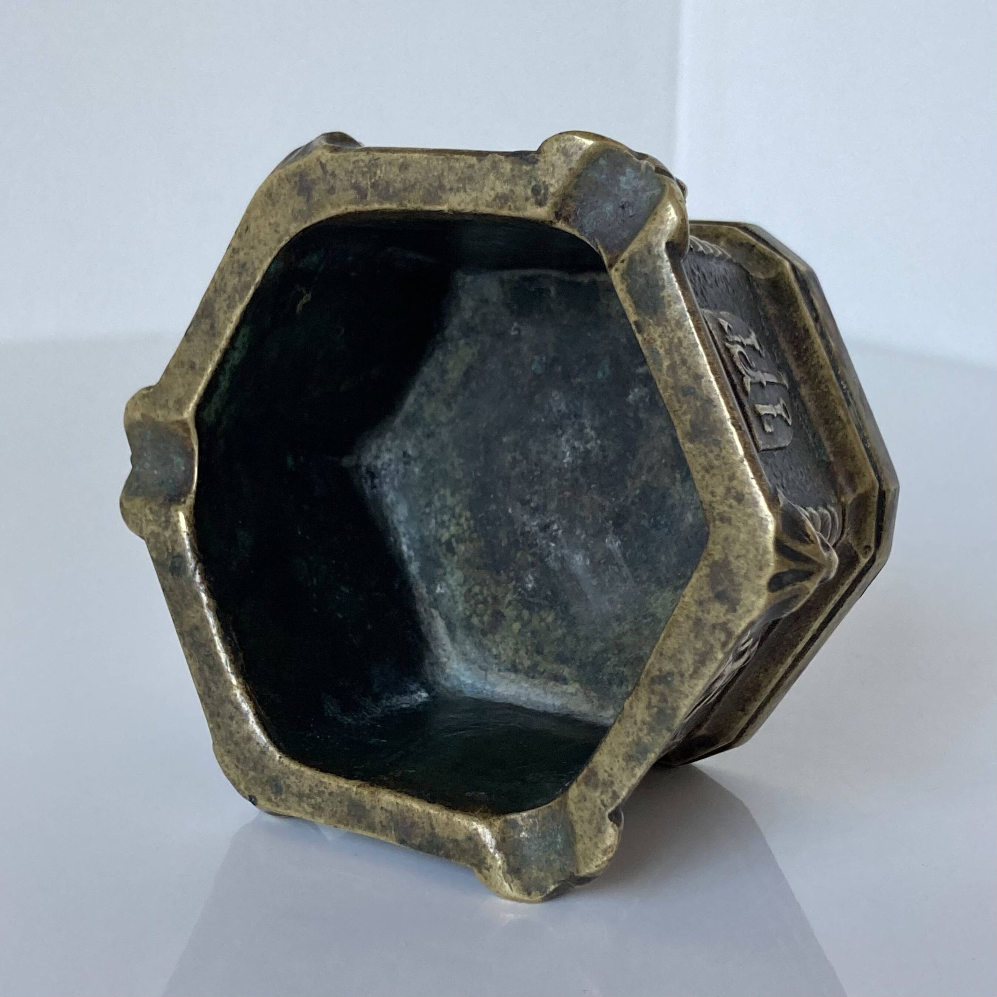 Gothic style bronze ashtray in the shape of a well with heraldic motifs by Max Le Verrier